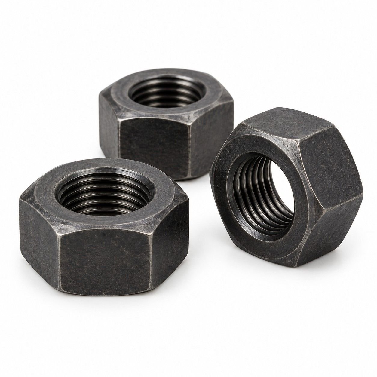 Representative dark carbon steel heavy hex nuts with machined internal threads